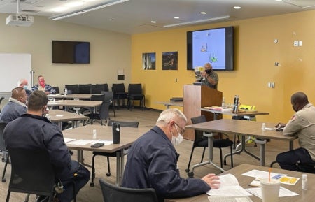 Forklift training People in classroom studying forklift material.