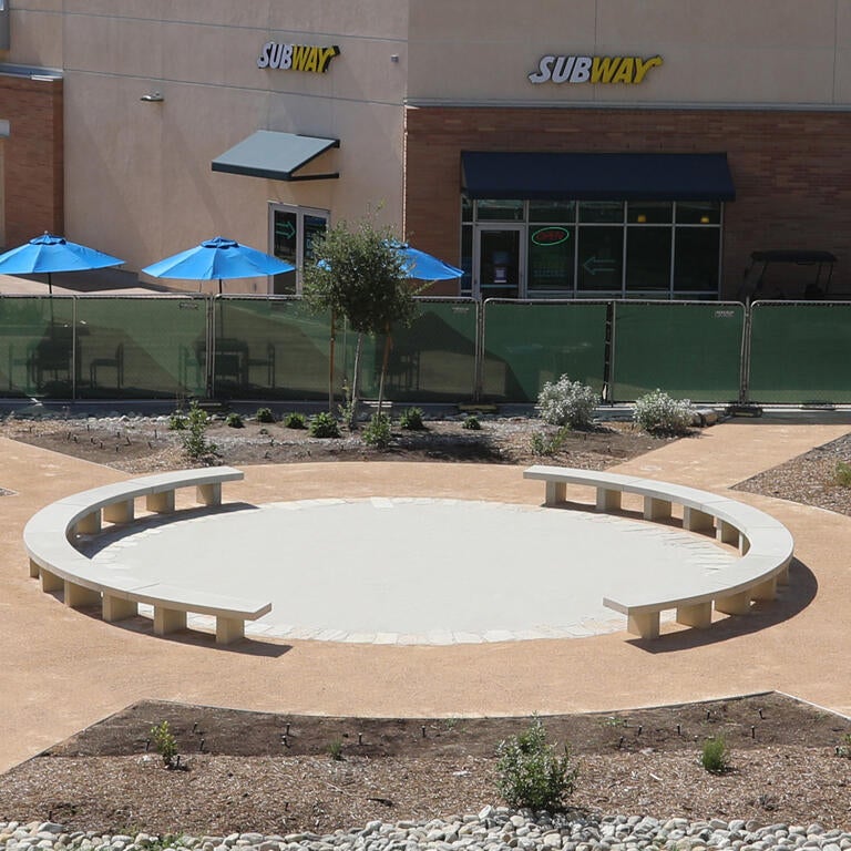 Round pathway with drought-tolerant plants around it